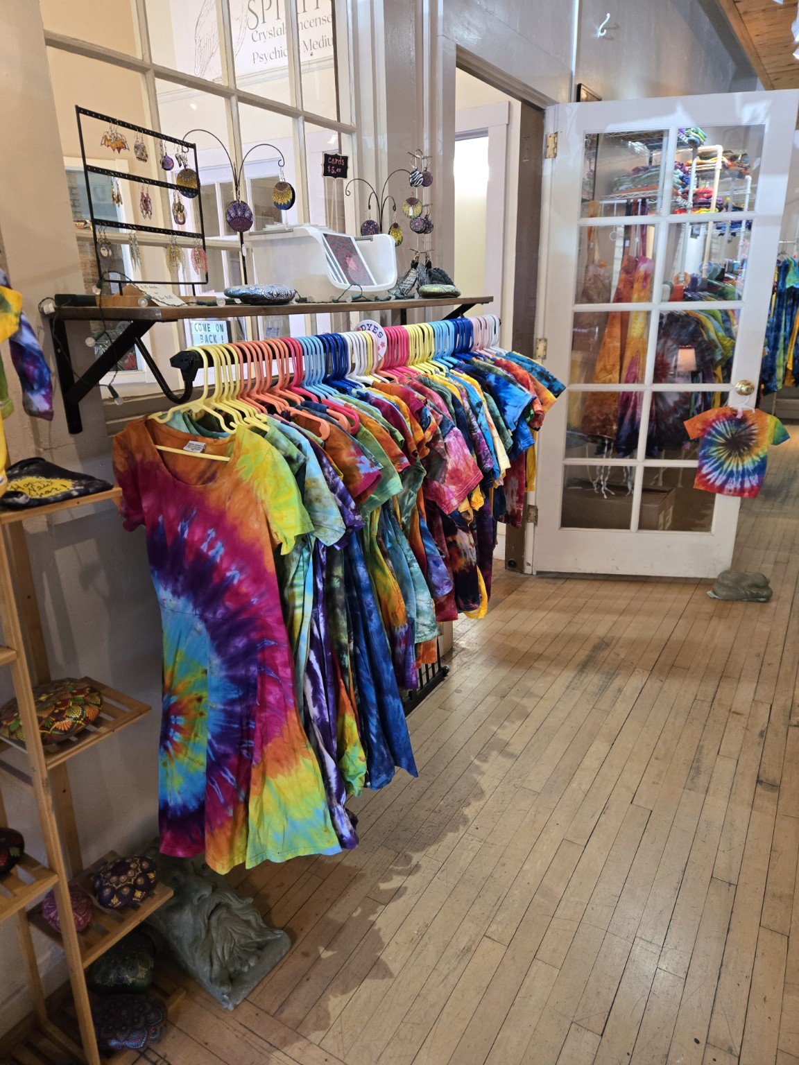 Colorful tie-dye clothing on display at Doc’s Dyes